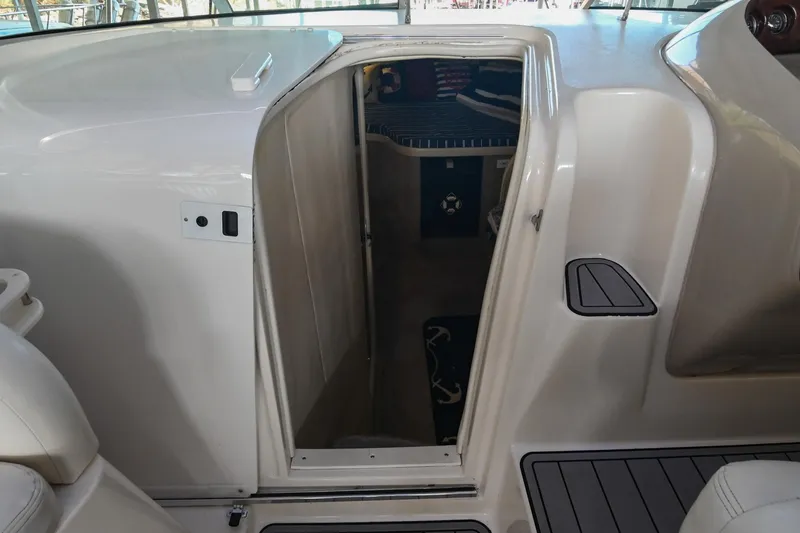 Slide: The Image of 2000 Rinker Fiesta Vee 330 cabin entrance with white interior and seating. - 21