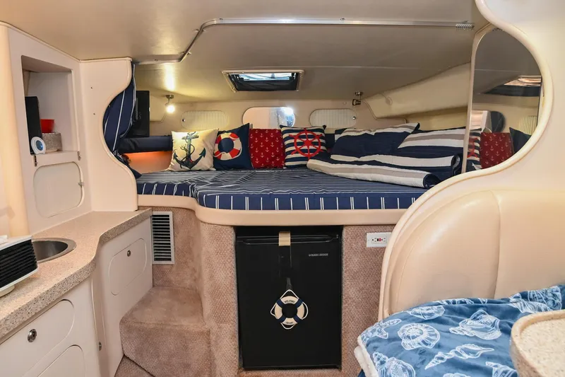 Slide: The Image of Interior of 2000 Rinker Fiesta Vee 330 boat with cozy cabin and nautical decor. - 30