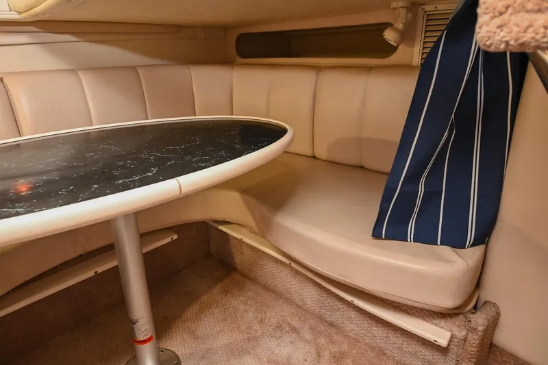 Slide: The Image of 2000 Rinker Fiesta Vee 330 cabin interior with seating and table. - 37