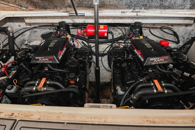 Slide: The Image of Twin engines in a 2000 Rinker Fiesta Vee 330 boat engine compartment. - 46