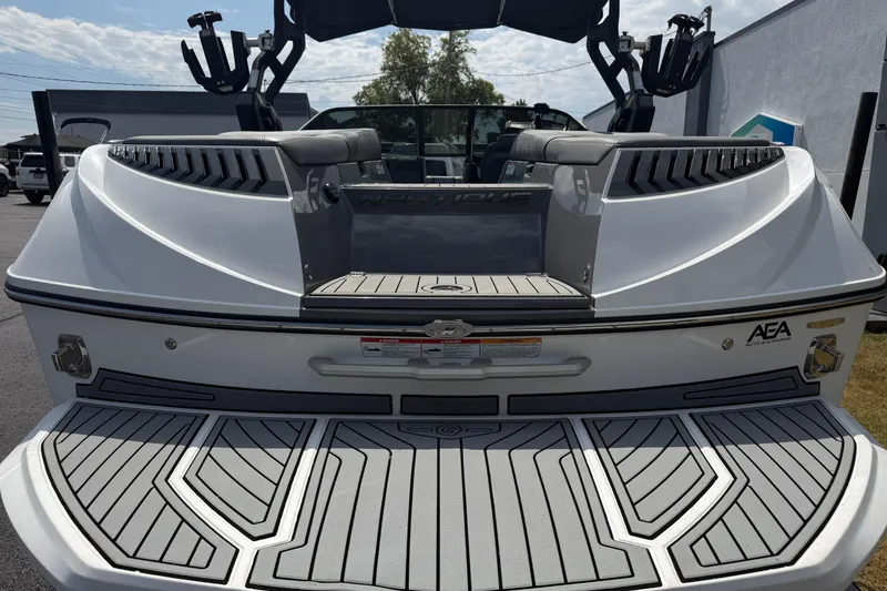 Slide: The Image of 2018 Nautique Super Air Nautique G23 boat, rear view with swim platform and seating. - 11