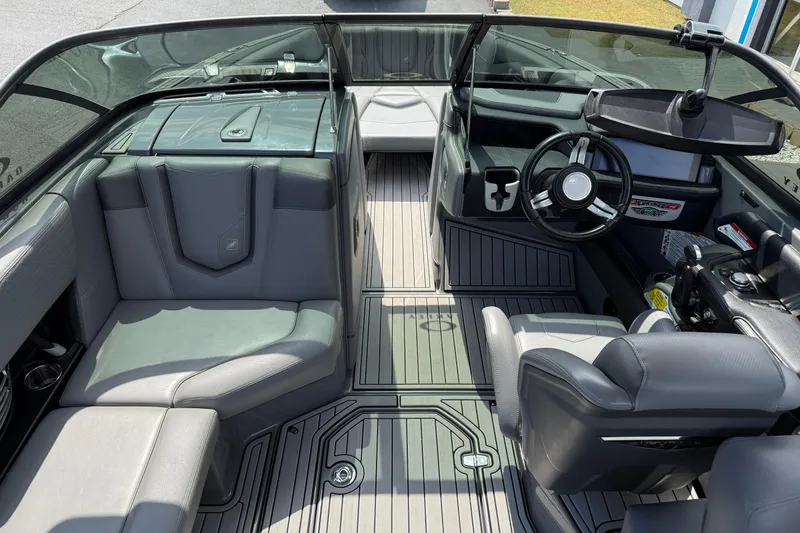 Slide: The Image of 2018 Nautique Super Air Nautique G23 interior with sleek seating and modern dashboard. - 14