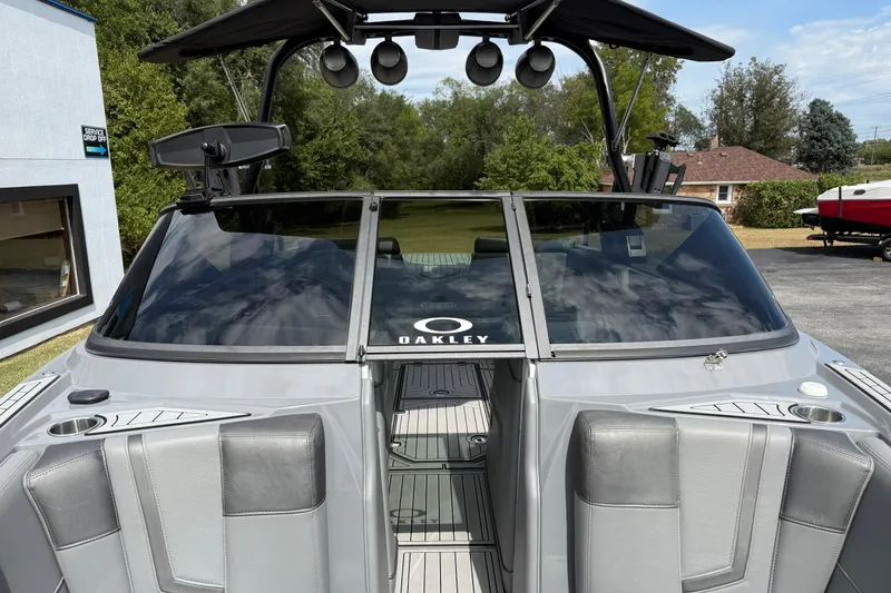 Slide: The Image of 2018 Nautique Super Air Nautique G23 boat with sleek gray interior and windshield. - 21