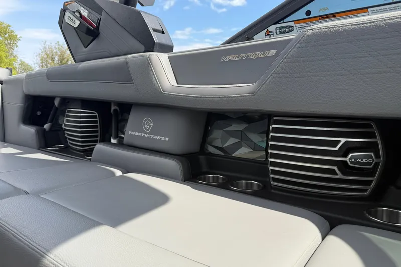Slide: The Image of 2018 Nautique Super Air Nautique G23 interior with JL Audio speakers and sleek design. - 25