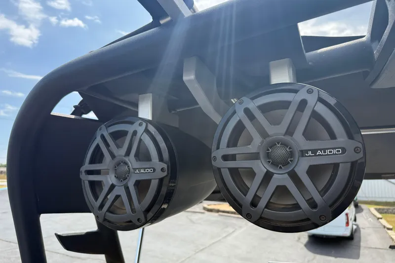 Slide: The Image of 2018 Nautique Super Air Nautique G23 with JL Audio speakers on a sunny day. - 30
