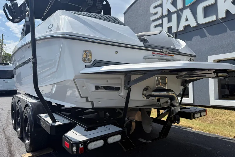 Slide: The Image of 2018 Nautique Super Air Nautique G23 boat on trailer outside Ski Shack. - 9