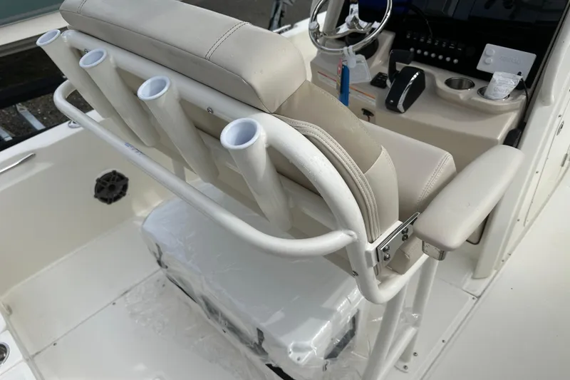 Slide: The Image of Boston Whaler 250 Dauntless 2026 boat interior with rod holders and steering console. - 4