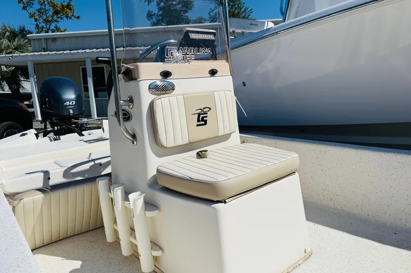 Slide: The Image of 2019 Carolina Skiff JV17CC boat interior with seating and console, featuring a 40 HP engine. - 4
