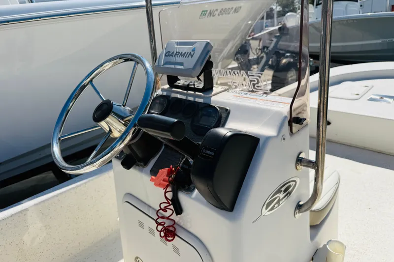 Slide: The Image of 2019 Carolina Skiff JV17CC boat console with Garmin navigation and Yamaha controls. - 6