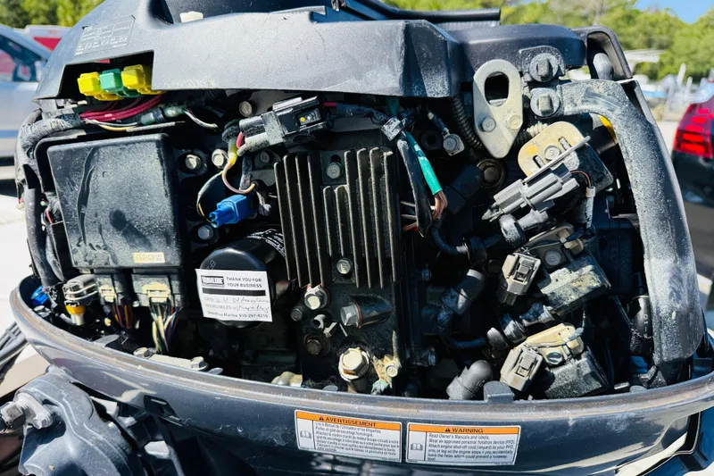 Slide: The Image of 2019 Carolina Skiff JV17CC boat engine close-up, showcasing internal components and wiring. - 8