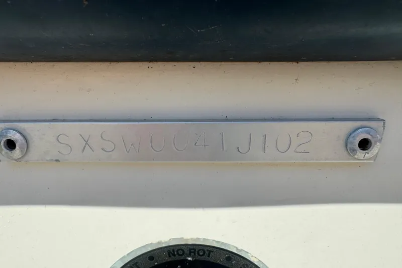 Slide: The Image of Hull identification number on 2002 Seahunt Triton 202 boat. - 12