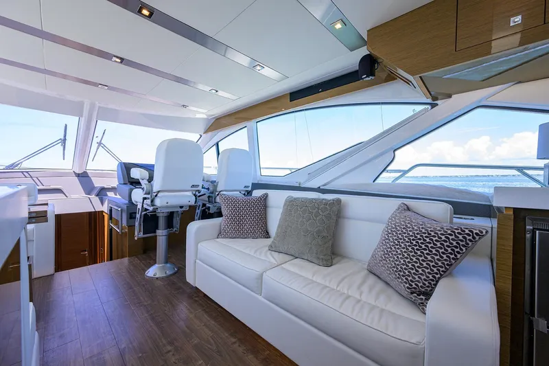 Slide: The Image of Luxurious interior of 2018 Cruisers 60 Cantius Fly yacht with plush seating and ocean view. - 25