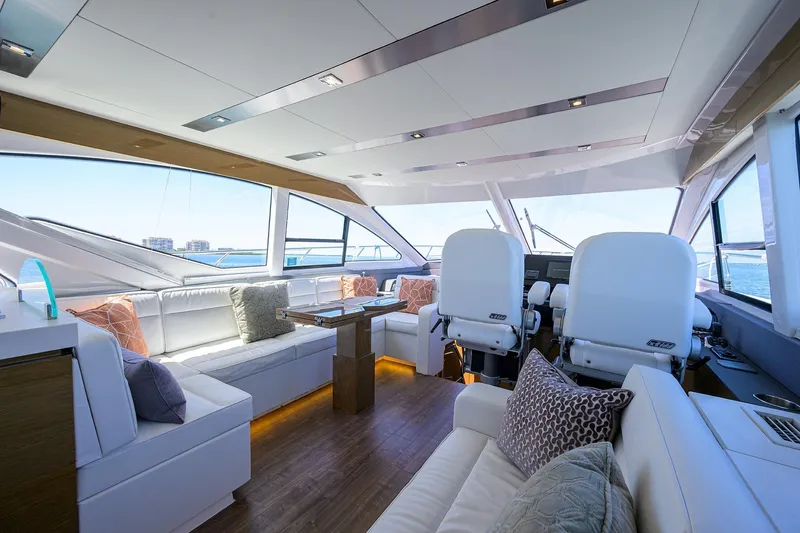 Slide: The Image of Luxurious interior of 2018 Cruisers 60 Cantius Fly yacht with modern seating and panoramic windows. - 30
