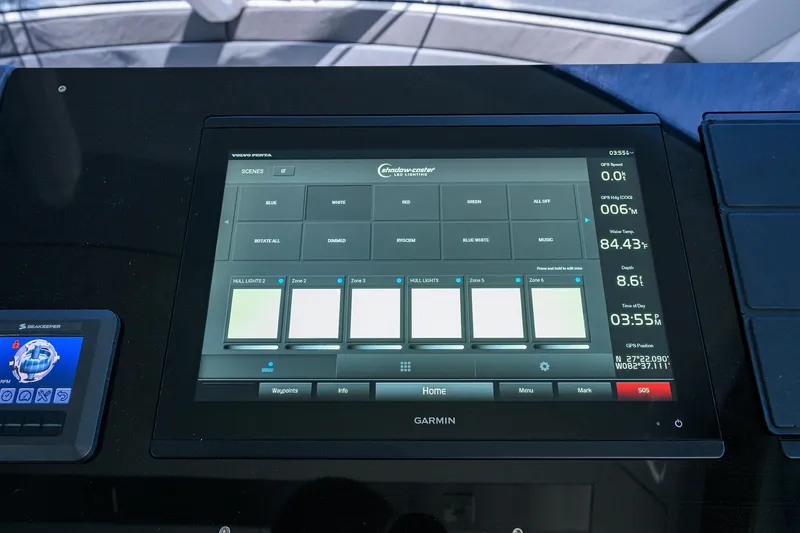 Slide: The Image of Touchscreen control panel on 2018 Cruisers 60 Cantius Fly yacht, displaying navigation and lighting settings. - 36