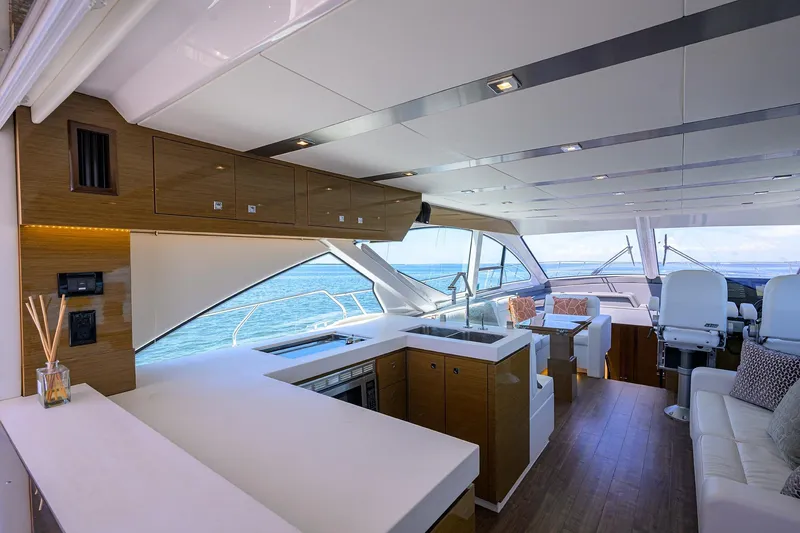 Slide: The Image of Luxurious interior of 2018 Cruisers 60 Cantius Fly yacht with modern kitchen and seating area. - 38