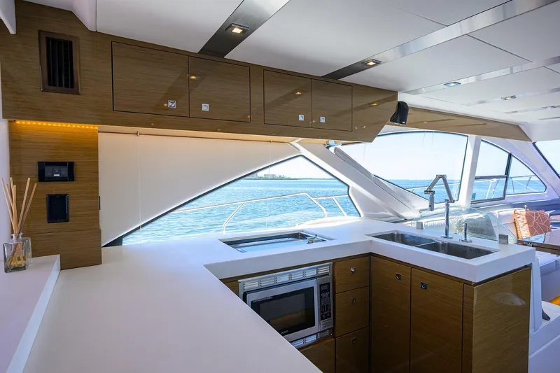 Slide: The Image of Luxurious interior of 2018 Cruisers 60 Cantius Fly yacht with modern kitchen and ocean view. - 40