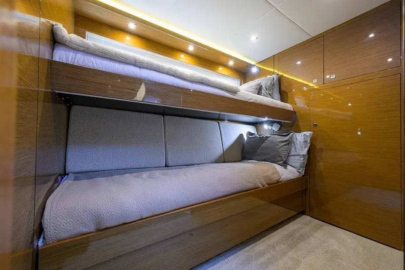Slide: The Image of Luxurious 2018 Cruisers 60 Cantius Fly yacht cabin with cozy bunk beds. - 44