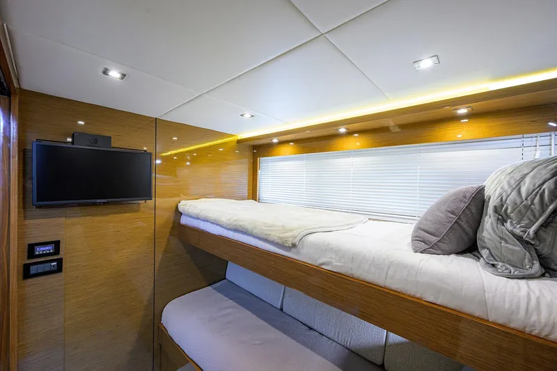 Slide: The Image of Luxurious interior of 2018 Cruisers 60 Cantius Fly yacht with cozy bunk beds. - 45