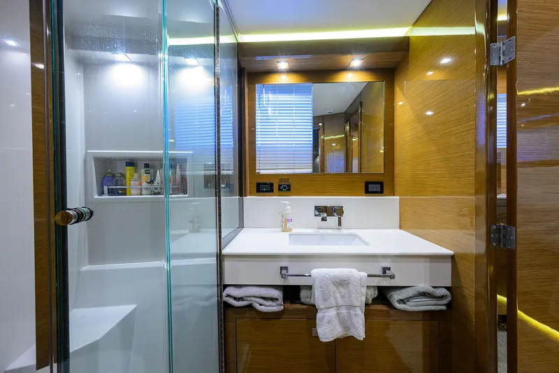 Slide: The Image of Luxurious bathroom in 2018 Cruisers 60 Cantius Fly yacht with modern fixtures and glass shower. - 50