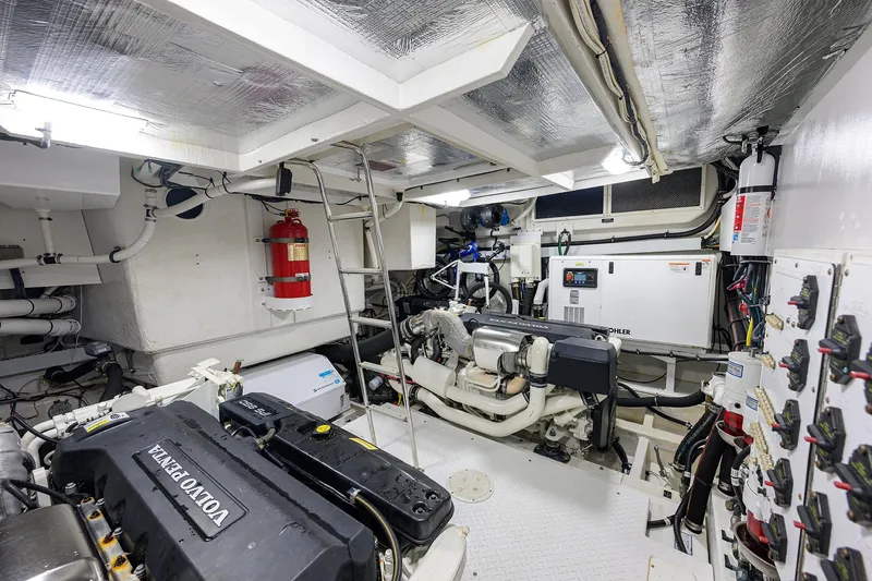 Slide: The Image of Engine room of 2018 Cruisers 60 Cantius Fly yacht with Volvo Penta engines. - 62