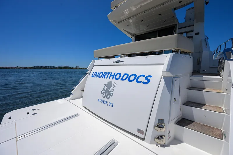 Slide: The Image of 2018 Cruisers 60 Cantius Fly yacht named "Unorthodocs" docked in Austin, TX. - 14