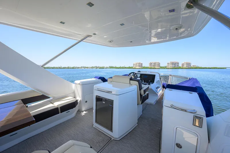 Slide: The Image of 2018 Cruisers 60 Cantius Fly yacht interior with scenic water view. - 16