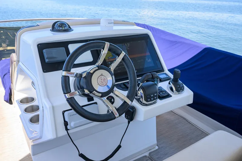 Slide: The Image of Helm of 2018 Cruisers 60 Cantius Fly yacht with modern controls and steering wheel. - 22