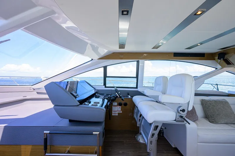 Slide: The Image of Interior of 2018 Cruisers 60 Cantius Fly yacht with modern helm and seating. - 34