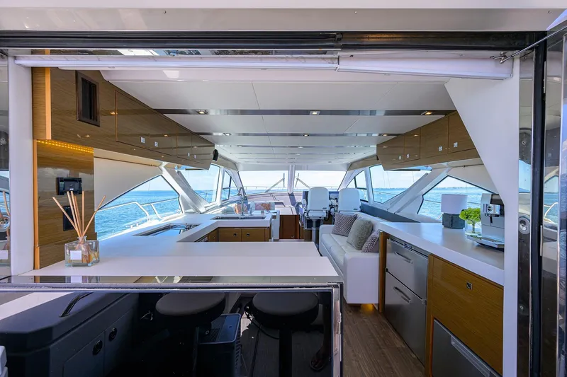 Slide: The Image of Luxurious interior of 2018 Cruisers 60 Cantius Fly yacht with modern kitchen and seating area. - 37