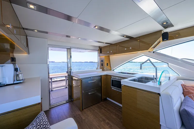 Slide: The Image of Luxurious interior of 2018 Cruisers 60 Cantius Fly yacht with modern kitchen and ocean view. - 43