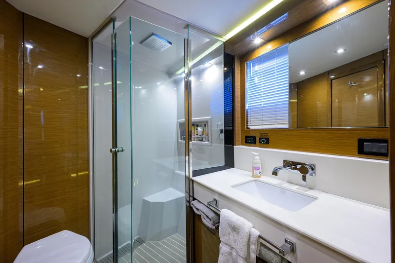 Slide: The Image of Luxurious bathroom in 2018 Cruisers 60 Cantius Fly yacht with modern fixtures and glass shower. - 51