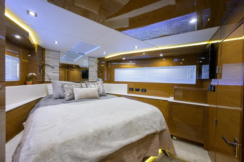 Slide: The Image of Luxurious bedroom interior of 2018 Cruisers 60 Cantius Fly yacht with modern design and ambient lighting. - 52