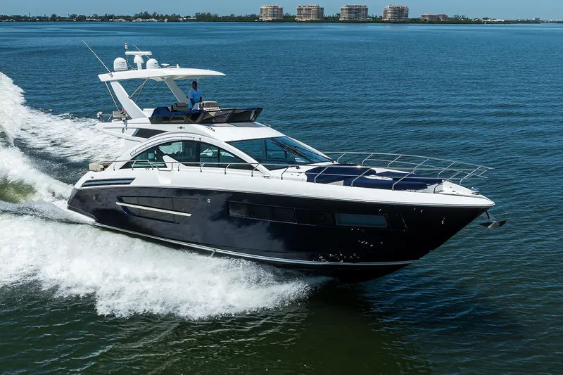 Slide: The Image of 2018 Cruisers 60 Cantius Fly yacht cruising on open water. - 6