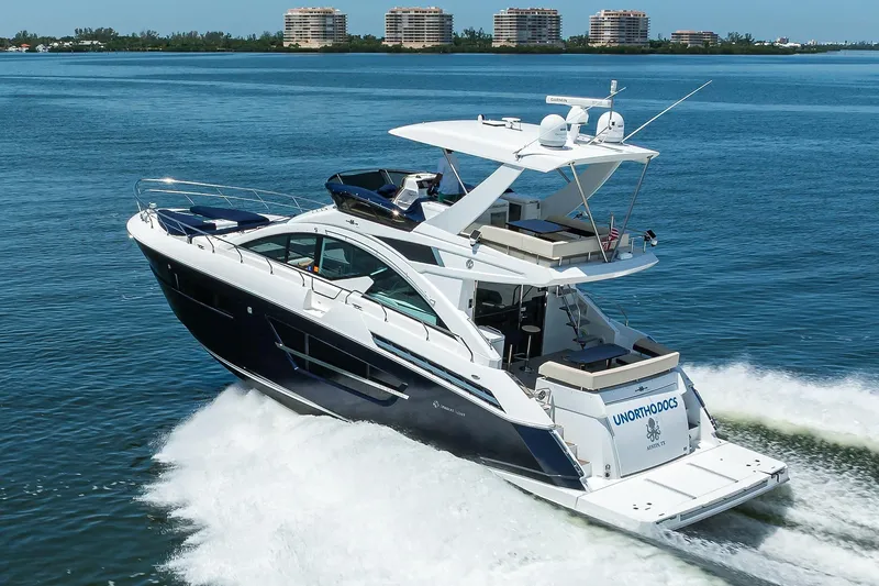 Slide: The Image of 2018 Cruisers 60 Cantius Fly yacht cruising on blue water, luxury vessel. - 8