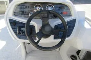 Slide: The Image of Steering console of 2025 South Bay 16 FC SE boat with gauges and controls. - 10