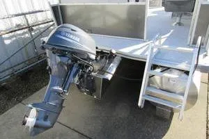 Slide: The Image of 2025 South Bay 16 FC SE boat with Yamaha outboard motor and ladder. - 12