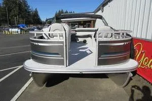 Slide: The Image of 2025 South Bay 16 FC SE pontoon boat parked outdoors. - 4