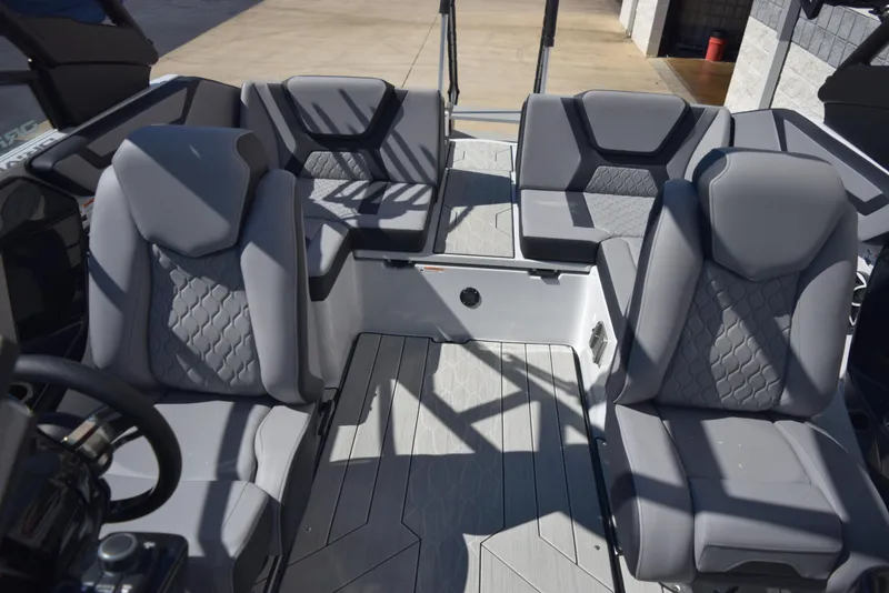 Slide: The Image of 2024 Yamaha Boats 222XD interior seating with gray upholstery. - 10