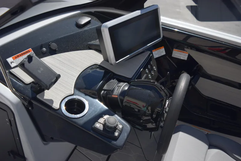 Slide: The Image of 2024 Yamaha Boats 222XD dashboard with touchscreen display and controls. - 11