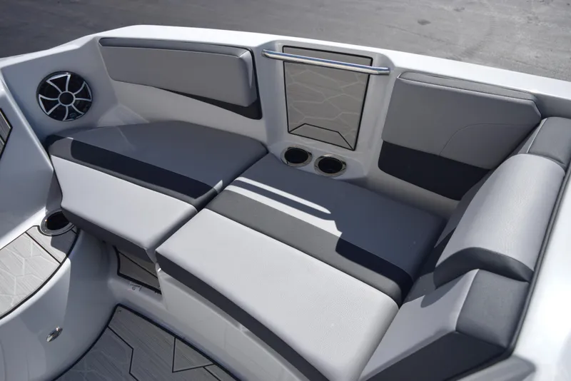 Slide: The Image of 2024 Yamaha Boats 222XD interior seating with cup holders and speaker. - 13