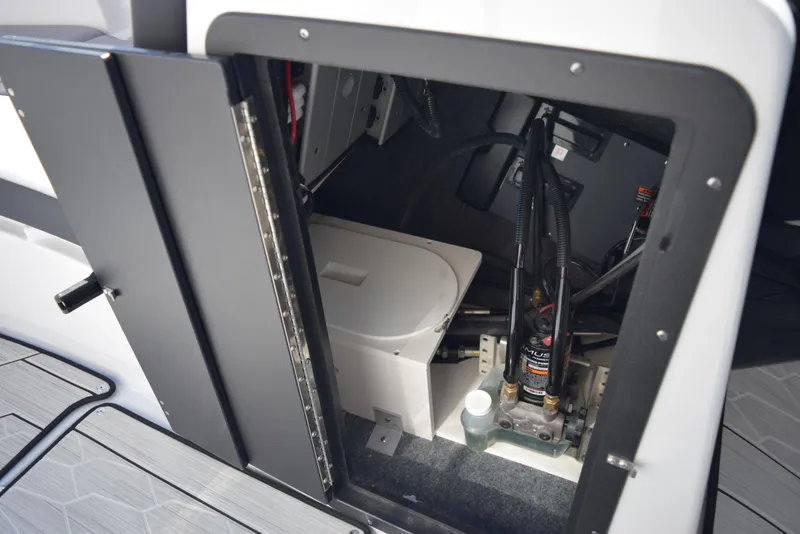 Slide: The Image of 2024 Yamaha Boats 222XD storage compartment and equipment. - 15