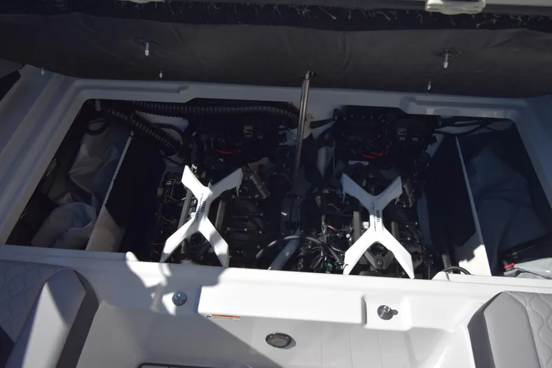 Slide: The Image of Engine compartment of 2024 Yamaha Boats 222XD, showcasing dual engines. - 18