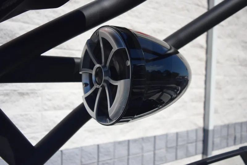 Slide: The Image of Close-up of a 2024 Yamaha Boats 222XD speaker on a black frame. - 21