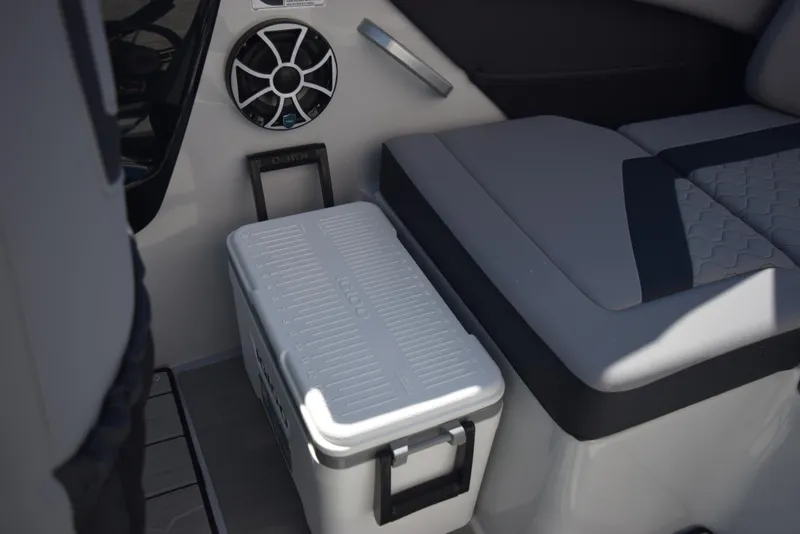 Slide: The Image of Interior of 2024 Yamaha Boats 222XD with seating and cooler. - 25