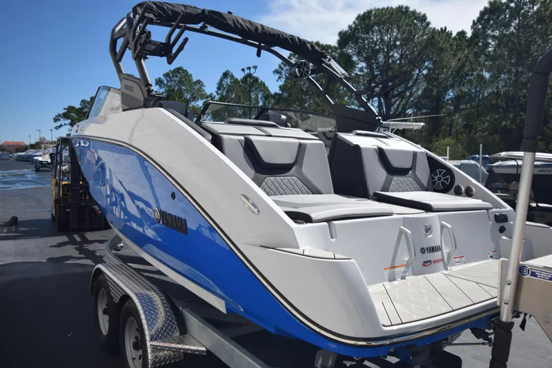 Slide: The Image of 2024 Yamaha Boats 222XD in blue and white on a trailer. - 4