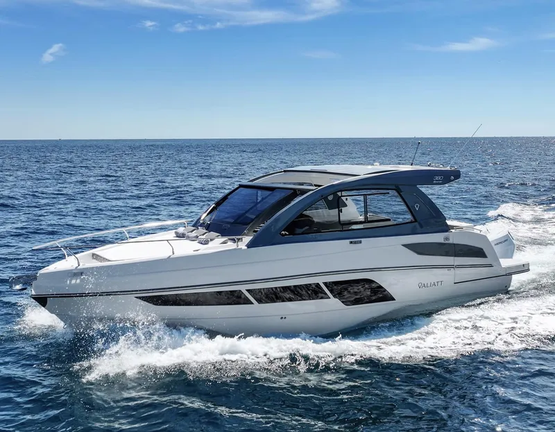 The Image of 2025 Valiatt 380 Bowrider cruising on open sea under clear blue sky. - 1