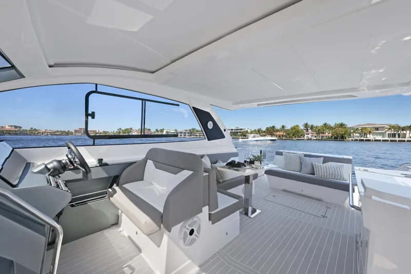 Slide: The Image of 2025 Valiatt 380 Bowrider interior with modern seating and scenic waterfront view. - 13