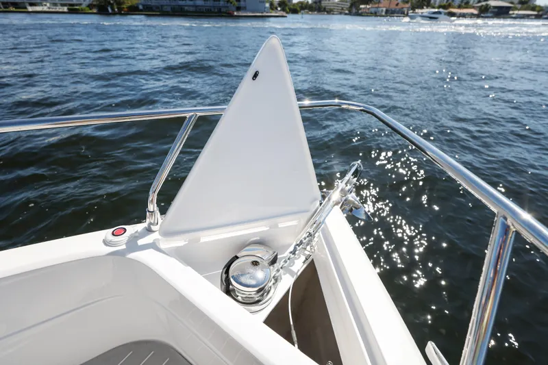 Slide: The Image of 2025 Valiatt 380 Bowrider boat bow with anchor, on sparkling water. - 25