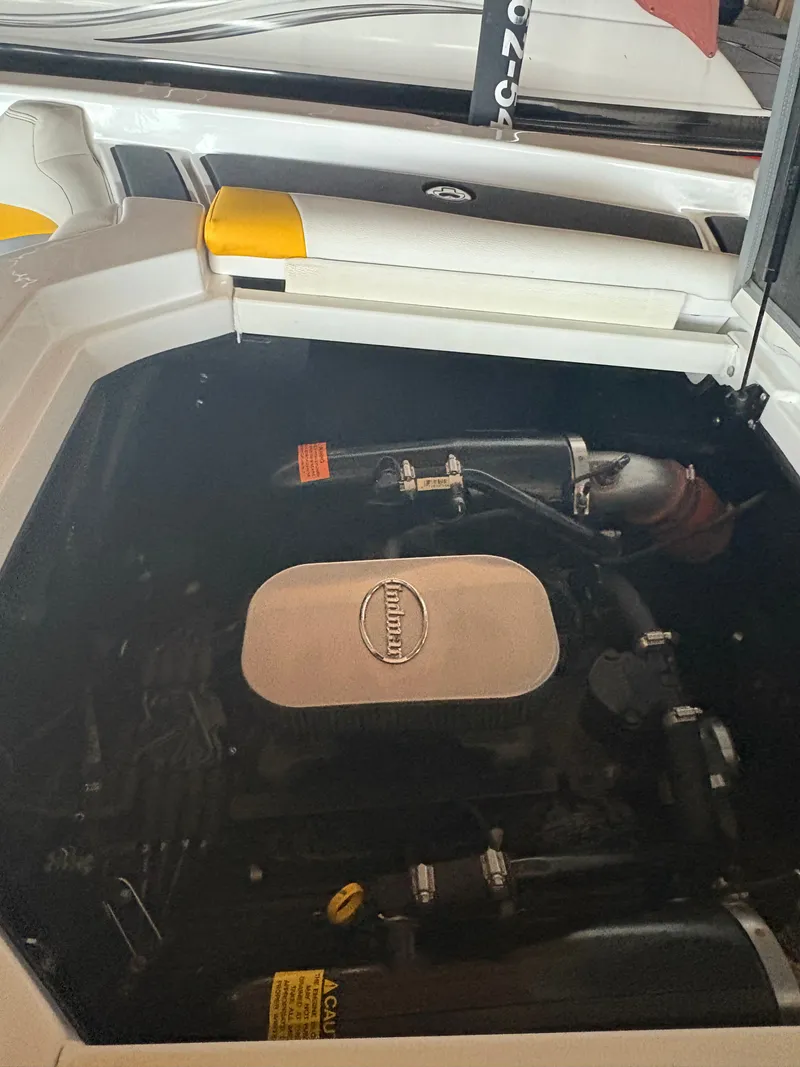 Slide: The Image of Engine compartment of a 2014 Tigé R20 boat, showcasing the Indmar engine. - 19