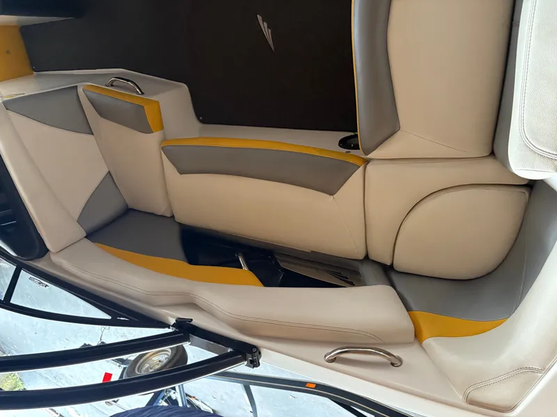 Slide: The Image of 2014 Tigé R20 boat interior with gray and yellow seating. - 7